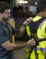 Royal Australian Air Force personnel wearing HeroWear Apex 2 exosuits during logistics operations