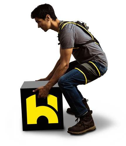 Man model side profile squatting lifting box wearing HeroWear Apex exosuit.